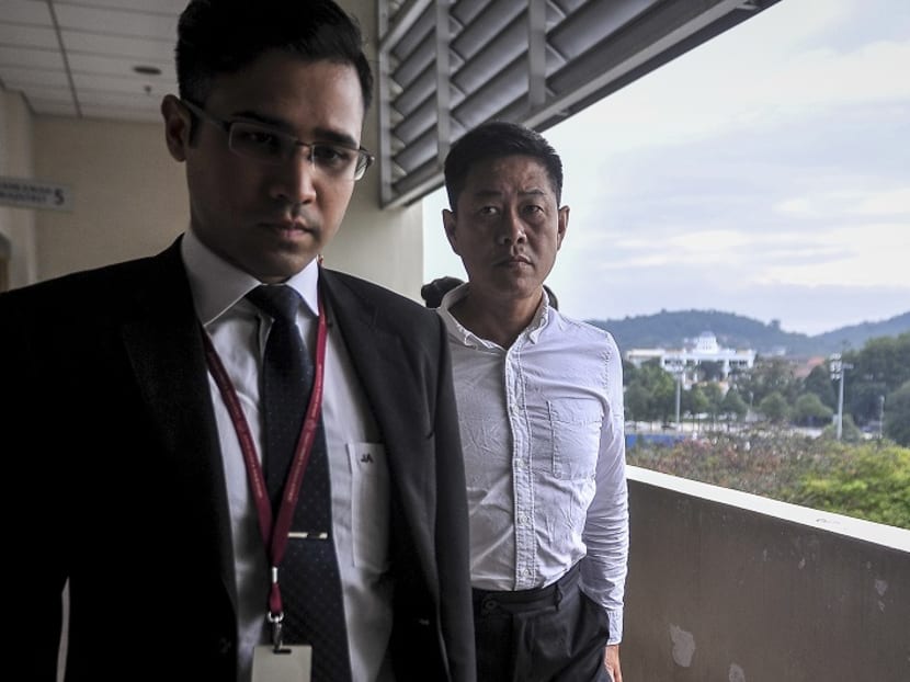 Singaporean businessman Yee Kok Chew (right) arrives at the Magistrate’s Court in Petaling Jaya January 8, 2018. Photo: The Malay Mail Online