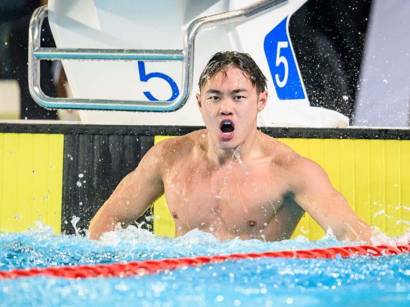 Teong Tze Wei celebrates his new SEA Games record in the 50m freestyle. 