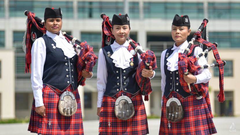 These members of the all-female Singapore police band can sing, dance and play the bagpipes These members of the all-female Singapore police band can sing, dance and play the bagpipes