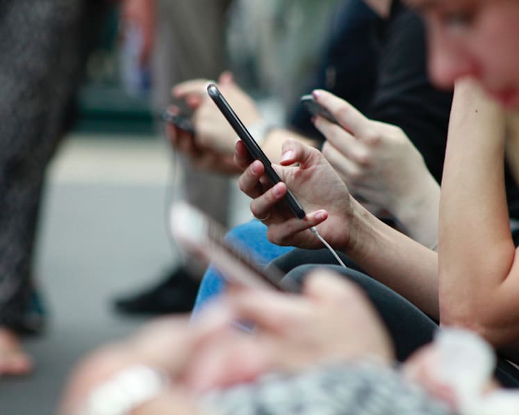 Parents glued to mobile devices are sending a wrong message to their children