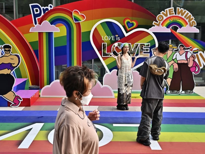 People take pictures in front of a Pride Month display in front of Siam Paragon shopping mall in Bangkok on June 21, 2023. People take pictures in front of a Pride Month display in front of Siam Paragon shopping mall in Bangkok on June 21, 2023.