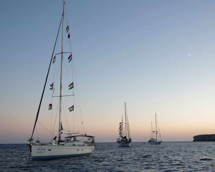 Gaza flotilla says Israeli vessels intimidated its boats as it nears blockade