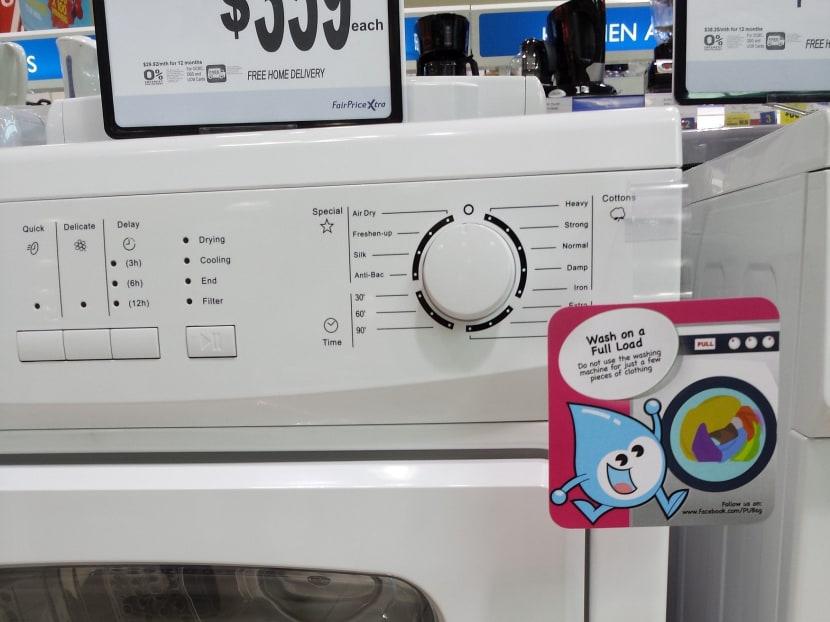 From April 1, washing machines that are not water efficient will no longer be sold in stores. PUB said only those with one or more ticks are allowed for sale. Photo: PUB
