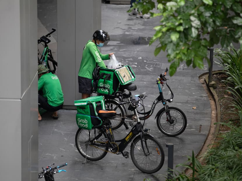 Food delivery rider loading orders at Westgate shopping mall on May 17, 2021.