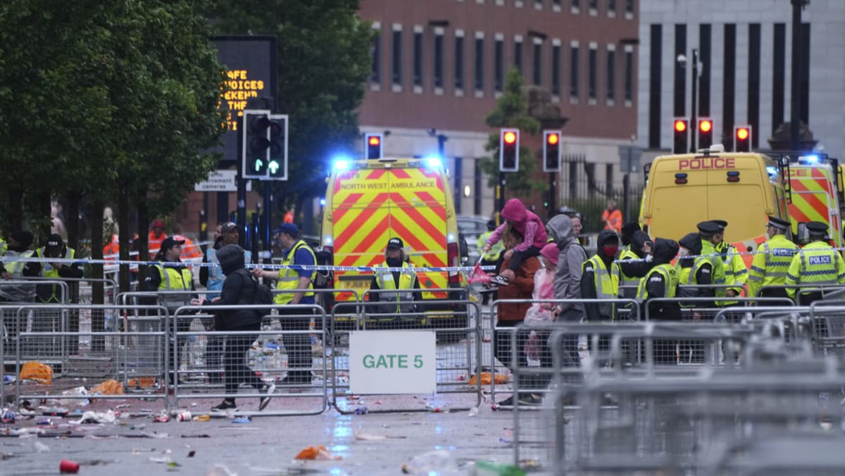 Man detained after car hit crowds at Liverpool’s title parade