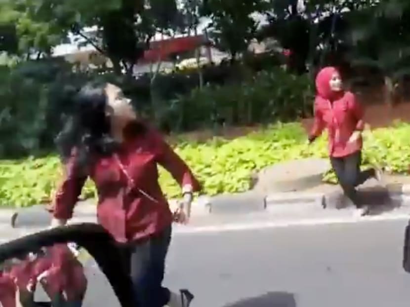 People run onto the road following an earthquake in Jakarta on Tues (Jan 23) in this still image obtained from social media video. Photo: Instagram @ARDHANAGUMAY.REAL