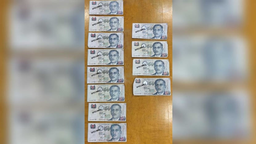 Two men to be charged with use, possession of counterfeit S$50 notes
