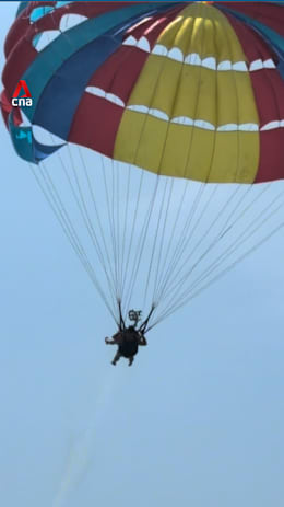 Tourist in Phuket falls into sea after parasailing rope snaps