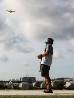 An enthusiast flying a drone at the unmanned aircraft flying area at Pandan Reservoir on July 17, 2022.