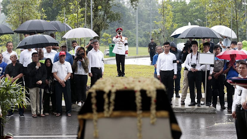 Crowds brave torrential downpour as Othman Wok is laid to rest