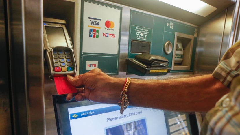 Elderly commuters try using machines for first time as 11 MRT stations stop cash top-ups at service counters