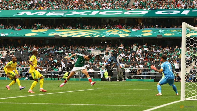 Mexico get World Cup party started with 2-0 win over nine-man South Africa