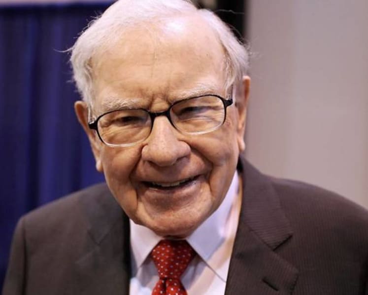 Buffett's firm sells off financials, halves Chevron stake
