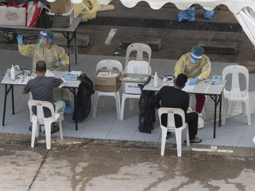 Workers at the medical post in Toh Guan Dormitory on April 30, 2020.