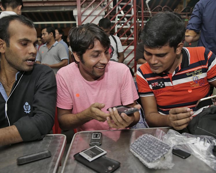 450 needy foreign workers set to get new phones ahead of 3G shift