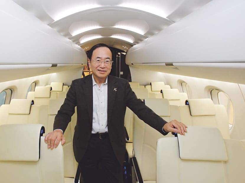 Mitsubishi Aircraft chairman Hideo Egawa inside a mock-up of the MRJ’s cabin, which features relatively wide seats and high ceilings. 
Photo: Reuters