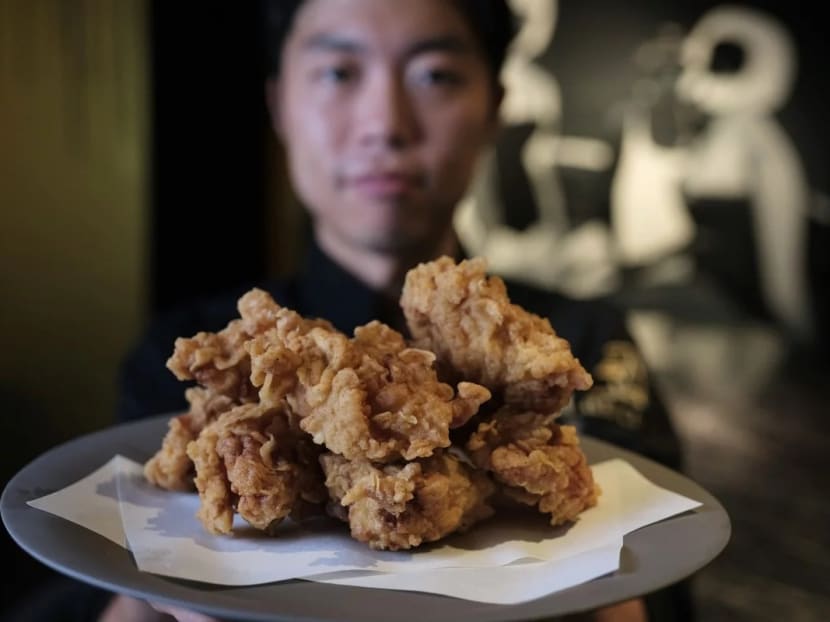 Chef Yong Soo-do with his Korean fried chicken, whose preparation includes marinating it overnight in brine, then putting it in a tempura batter with home-made chicken powder. Chef Yong Soo-do with his Korean fried chicken, whose preparation includes marinating it overnight in brine, then putting it in a tempura batter with home-made chicken powder.