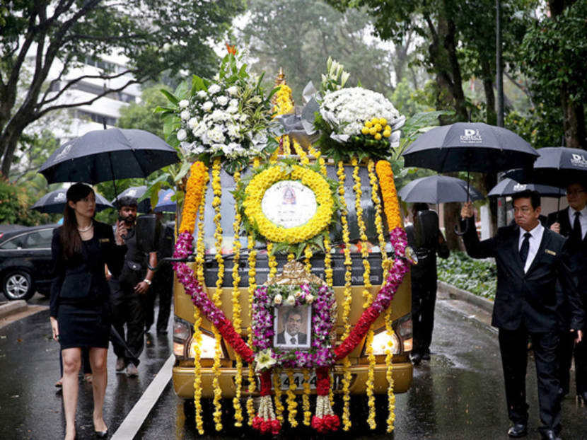 The funeral hearse of prominent Singaporean criminal lawyer Subhas Anandan in procession shortly after departing his residence. Photo: Wee Teck Hian