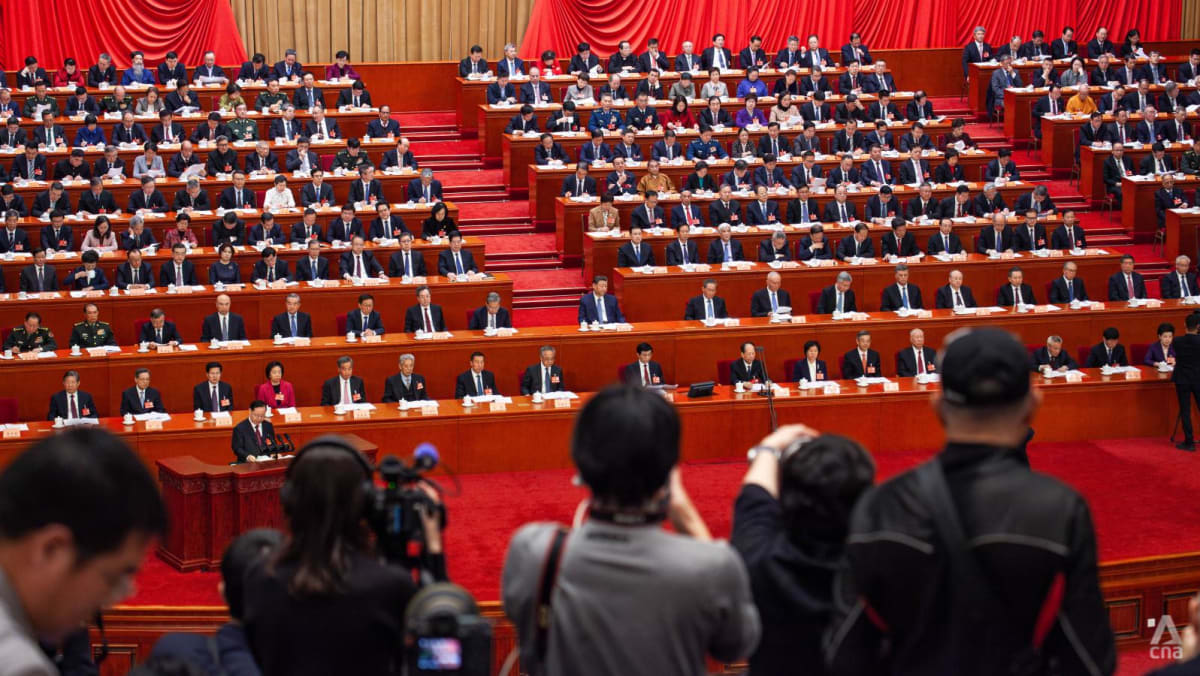China sets GDP growth target of 'around 5%' for third year running, despite worsening trade war