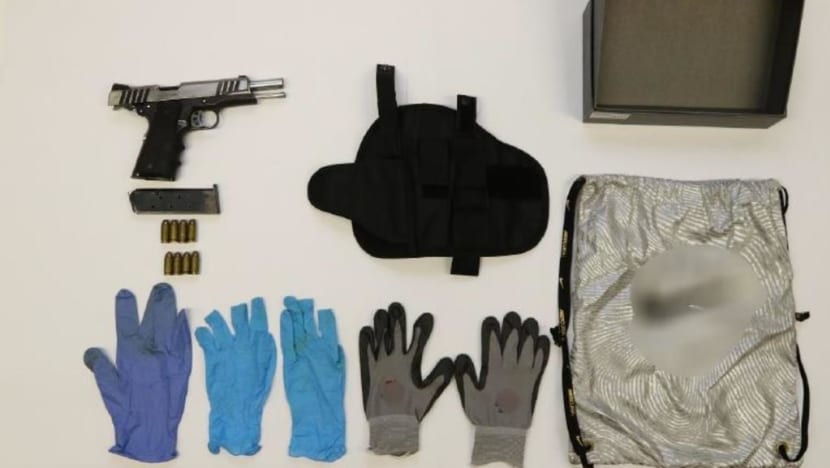 Two men charged with firearms offences after loaded pistol found in Jurong West flat