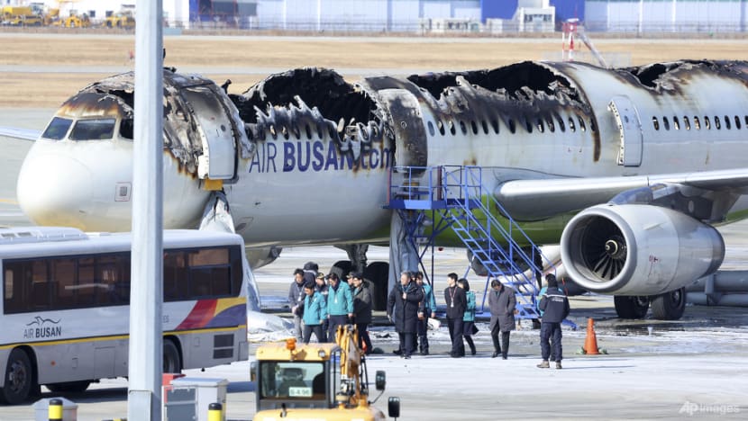 Investigators cautious of jet fuel still aboard wrecked South Korean plane
