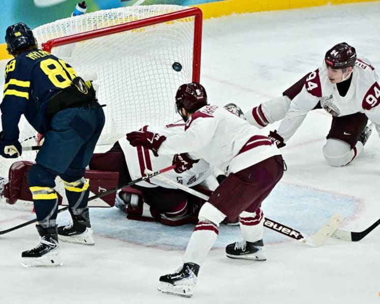 Ice hockey-Sweden beat Latvia to set men's quarter-final meeting with US