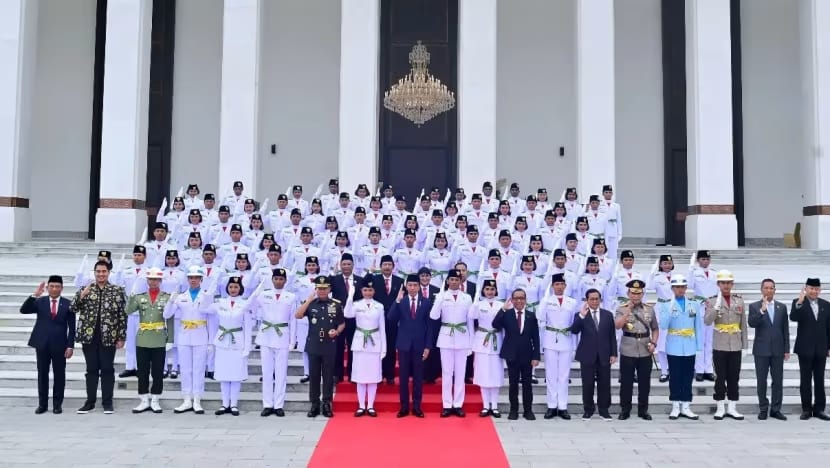 Indonesia allows female flag-raising troop members to don hijab at Independence Day ceremony, overturning earlier ban  Indonesia allows female flag-raising troop members to don hijab at Independence Day ceremony, overturning earlier ban