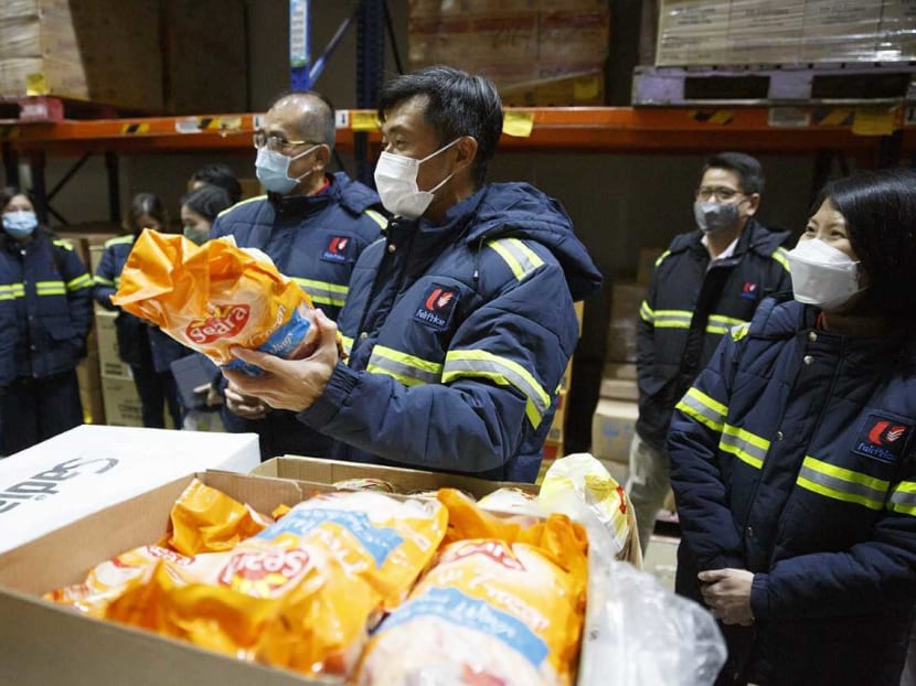 Minister of State for Home Affairs and Sustainability and the Environment Desmond Tan holds at a bag of frozen food during a visit to the NTUC Fresh Food Distribution Centre on May 26, 2022. Minister of State for Home Affairs and Sustainability and the Environment Desmond Tan holds at a bag of frozen food during a visit to the NTUC Fresh Food Distribution Centre on May 26, 2022.