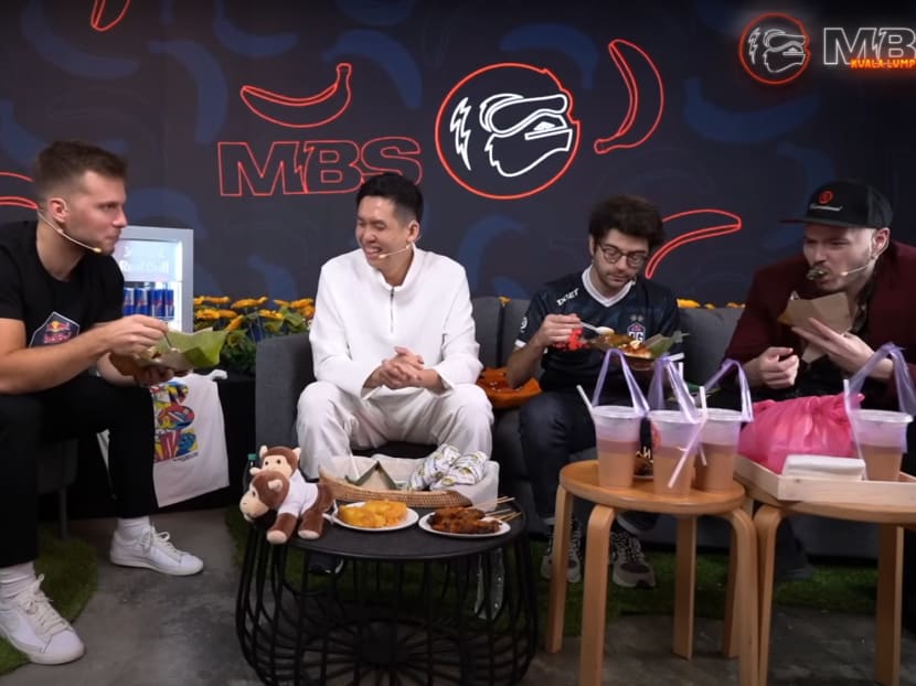 Dota 2 personality and former professional player Jake "SirActionSlacks" Kanner (far right) was shown eating the banana leaf that held a meal of nasi lemak in a Dec 17 podcast episode of The Monkey Business Show. Dota 2 personality and former professional player Jake "SirActionSlacks" Kanner (far right) was shown eating the banana leaf that held a meal of nasi lemak in a Dec 17 podcast episode of The Monkey Business Show.