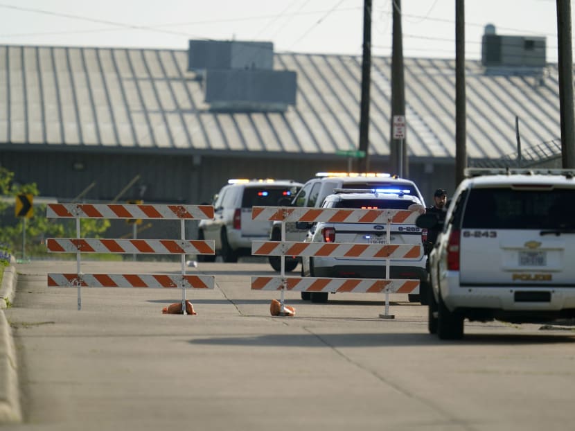 A Bryan police officer blocks access to an industrial park near the scene of a mass shooting in Bryan, Texas, US on April 8, 2021.