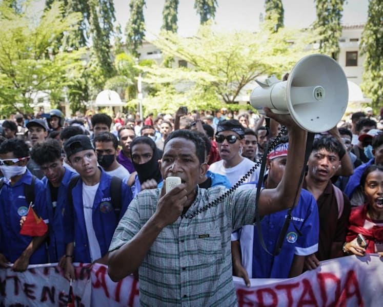 Timor-Leste police fire tear gas at protest over plan to buy cars for MPs