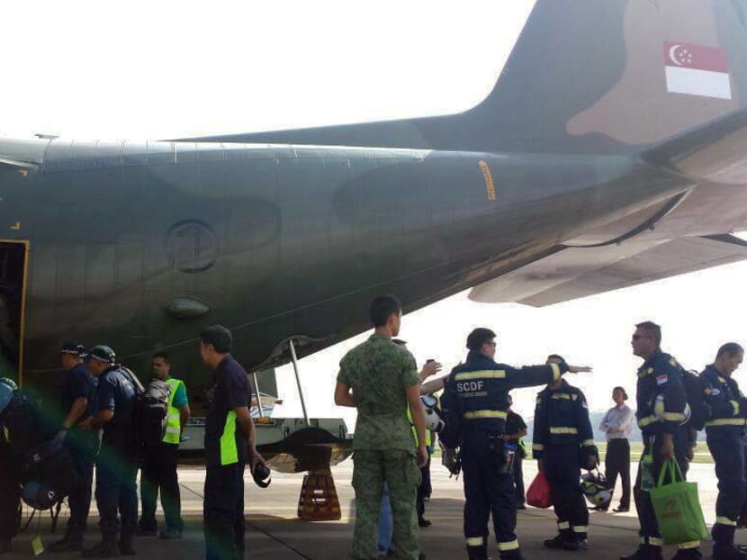 SPF and SCDF personnel boarding the C-130 bound for Nepal earlier this morning. Photo: Dr Ng Eng Hen's Facebook page