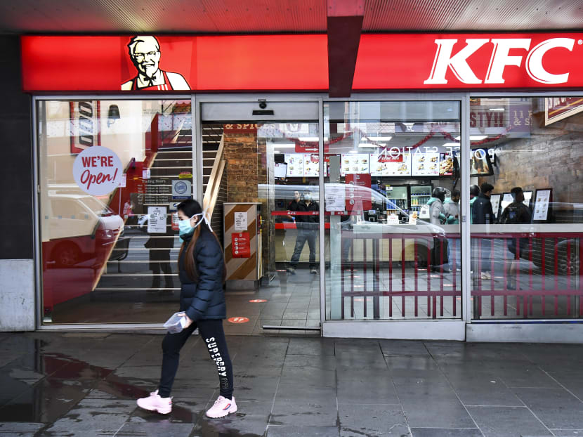 A person walks past a KFC outlet in Melbourne's central business district on Wednesday, July 15, 2020. Australians under lockdown for the second time are struggling with fresh virus restrictions, with police saying on July 15 they had dished out hundreds of fines including to people playing Pokemon Go and eating KFC. A person walks past a KFC outlet in Melbourne's central business district on Wednesday, July 15, 2020. Australians under lockdown for the second time are struggling with fresh virus restrictions, with police saying on July 15 they had dished out hundreds of fines including to people playing Pokemon Go and eating KFC.
