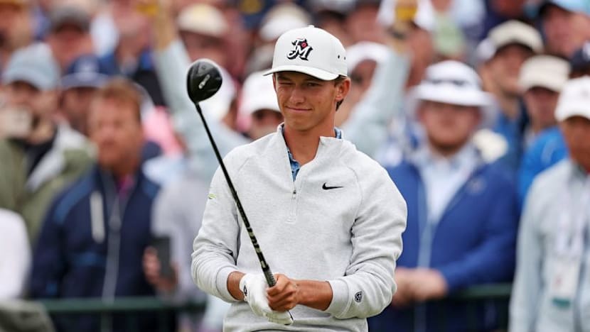 Teen Russell gets dad to caddie in US Open Father's Day gift