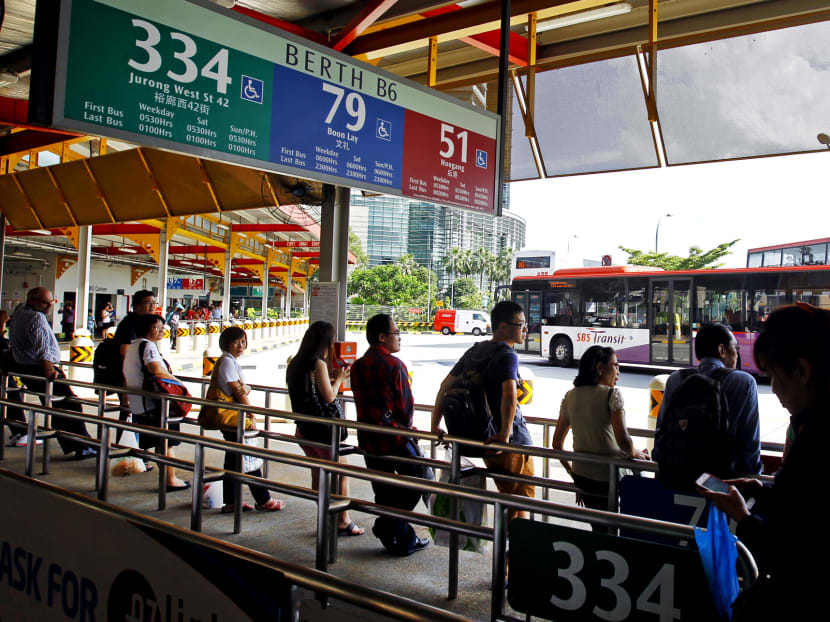 Commuters waiting for buses at Jurong East bus interchange. Photo: Ernest Chua