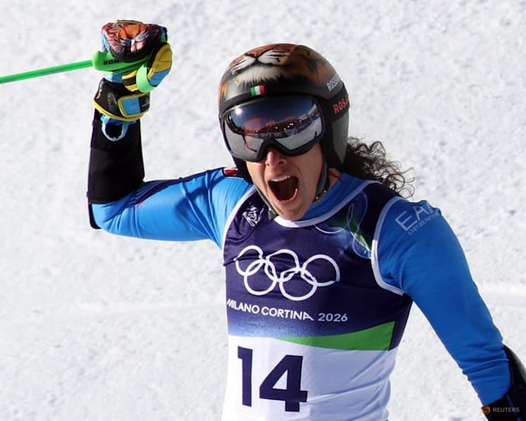 Alpine skiing-Brignone completes golden double on home snow