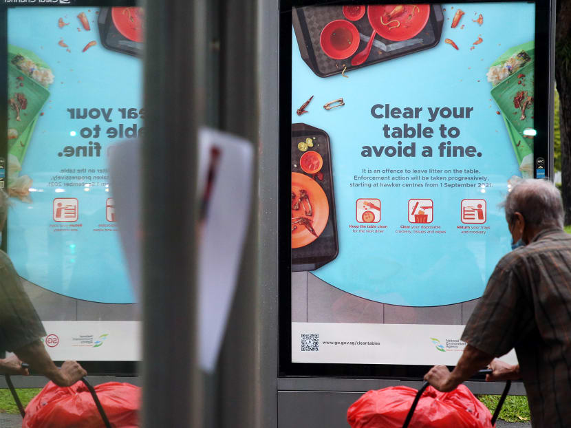 A poster at a bus-stop in Yishun informs the public of the NEA’s announcement earlier this week that from Sept 1, diners at hawker centres risk being warned or fined if they do not return their dirty trays and crockery, and clear litter on their tables after a meal. A poster at a bus-stop in Yishun informs the public of the NEA’s announcement earlier this week that from Sept 1, diners at hawker centres risk being warned or fined if they do not return their dirty trays and crockery, and clear litter on their tables after a meal.