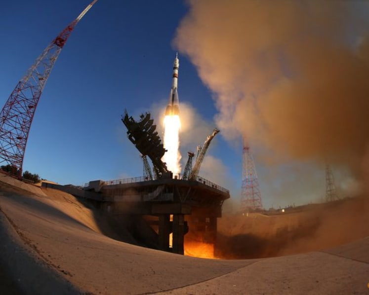 Russia sends American and two cosmonauts to space station with rare NASA chief visit