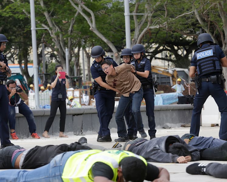 The Big Read: Gunfire on Paris streets sends a jolt halfway around the world