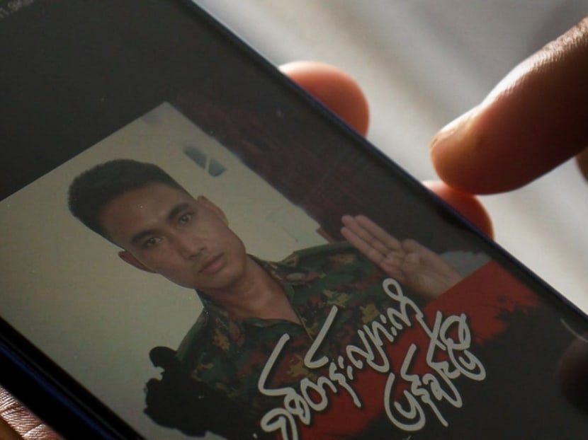 This screengrab provided via AFPTV and taken on March 14, 2021 shows Mr Shing Ling, a former Myanmar soldier who deserted the military to join the democracy movement in the aftermath of the military coup, looking at his Facebook profile showing his picture wearing a military uniform and holding up the three finger salute in Yangon. This screengrab provided via AFPTV and taken on March 14, 2021 shows Mr Shing Ling, a former Myanmar soldier who deserted the military to join the democracy movement in the aftermath of the military coup, looking at his Facebook profile showing his picture wearing a military uniform and holding up the three finger salute in Yangon.