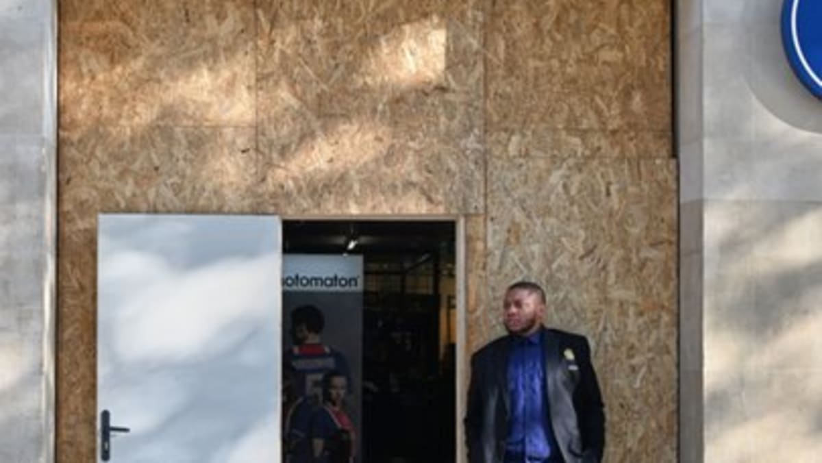 Paris shops board up storefronts ahead of Halloween protests