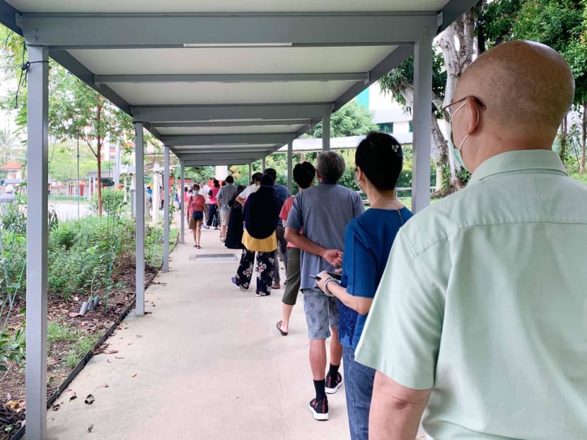 Voters queueing at the De La Salle School polling station in Chua Chu Kang around 9am on July 10, 2020. Voters queueing at the De La Salle School polling station in Chua Chu Kang around 9am on July 10, 2020.