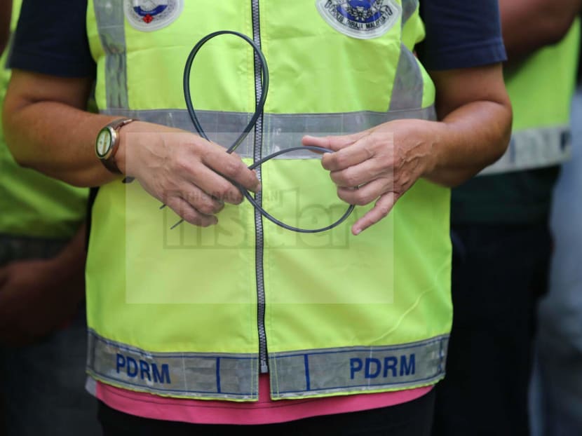 Malaysian cops say they are overweight because they are overworked. Malaysian Insider file photo.