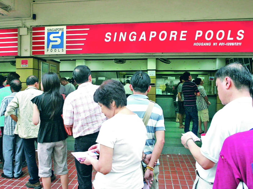 People queuing at a Singapore Pools outlet. TODAY file photo