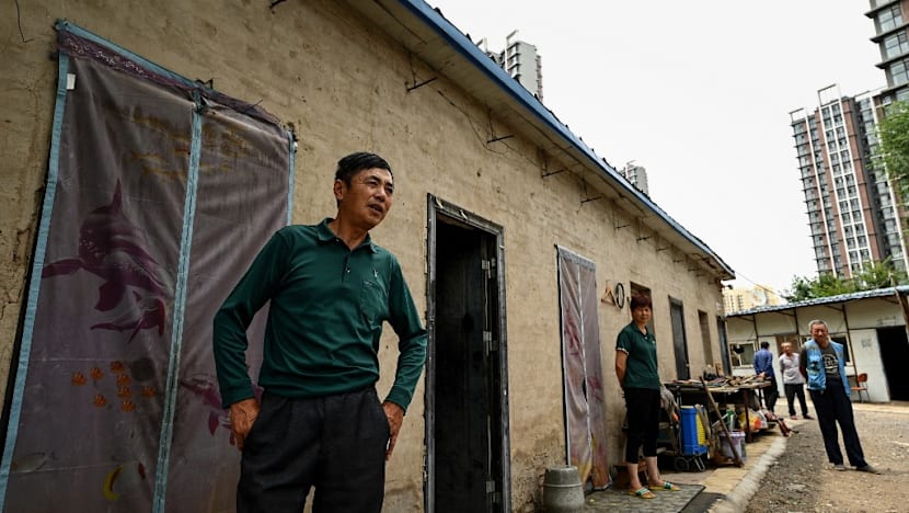 China signals it will relax household registration restrictions