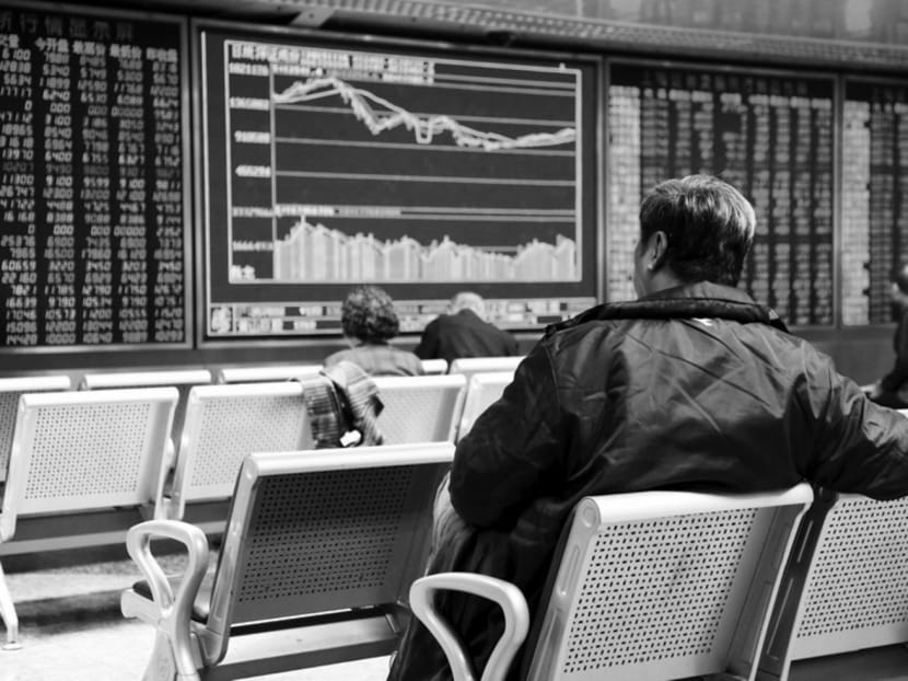 Investors at a brokerage house in Beijing yesterday. While massive official intervention may have halted the stock market plunge earlier this year, it could have permanently damaged regulators’ credibility. Photo: Reuters