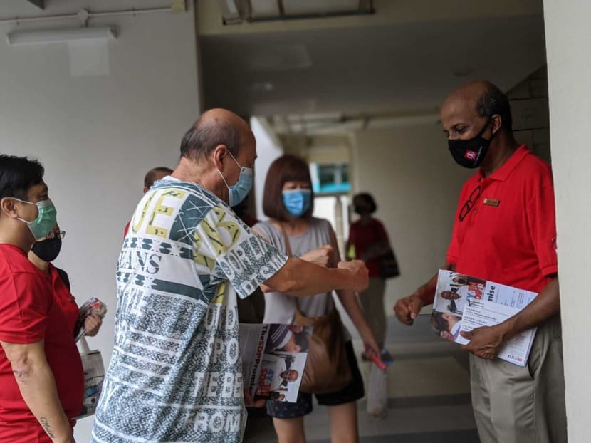 Singapore Democratic Party chairman Paul Tambyah (right) makes house visits in Pending Road, Bukit Panjang on July 3, 2020. Singapore Democratic Party chairman Paul Tambyah (right) makes house visits in Pending Road, Bukit Panjang on July 3, 2020.
