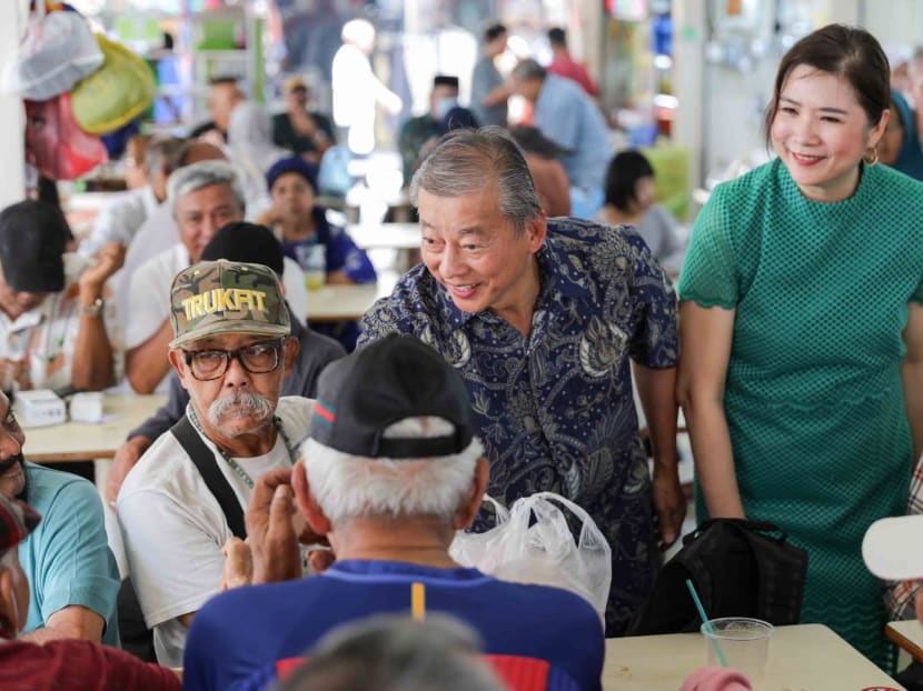 Aspiring presidential candidate George Goh and his wife visit Haig Road Market and Food Centre on July 30, 2023.