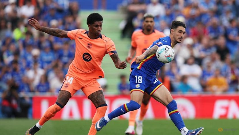 Barcelona march on towards title with 2-0 victory at Getafe