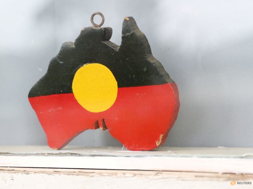 FILE PHOTO: A depiction of the Australian Aboriginal Flag is seen on a window sill at the home of indigenous Muruwari elder Rita Wright, a member of the "Stolen Generations", in Sydney, Australia, January 19, 2021. Picture taken January 19, 2021.  REUTERS/Loren Elliott/File Photo